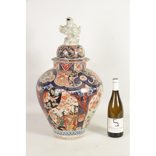 66 - A 19TH CENTURY JAPANESE LARGE INVERTED BALUSTER VASE AND COVER with colourful panelled floral and fl... 