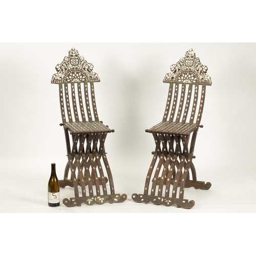 67 - A PAIR OF 19TH CENTURY ISLAMIC OTTOMAN HARDWOOD AND MOTHER OF PEARL INLAID FOLDING CHAIRS with shape... 