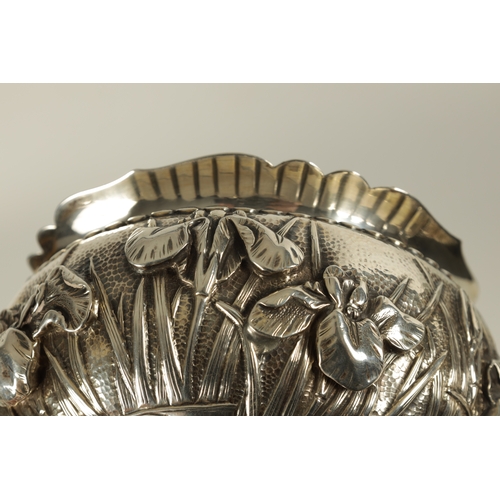 68 - A JAPANESE MEIJI PERIOD SOLID SILVER IRIS BOWL the scalloped flared rim above a footed bulbous body ... 