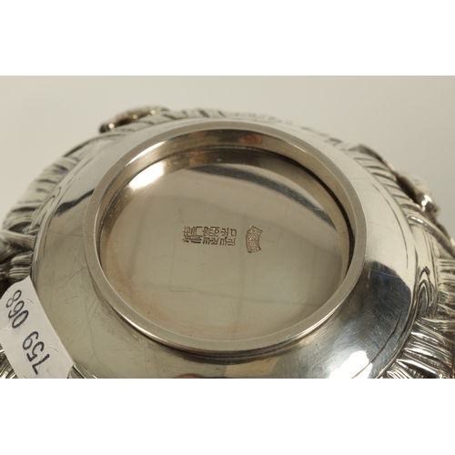 68 - A JAPANESE MEIJI PERIOD SOLID SILVER IRIS BOWL the scalloped flared rim above a footed bulbous body ... 