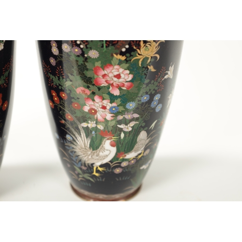 71 - A PAIR OF JAPANESE MEIJI PERIOD VASES on dark blue ground decorated with birds under flowers and blo... 