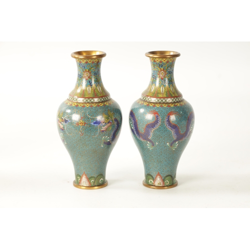 73 - A PAIR OF 20TH CENTURY CHINESE CLOISONNÉ ENAMEL VASES having finely decorated dragons and floral ban... 