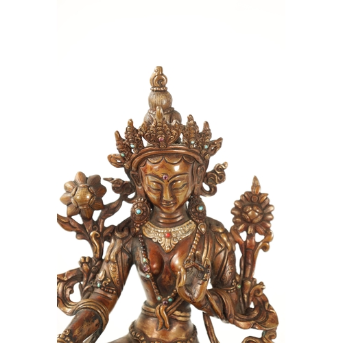 79 - A BRONZE AND JEWELLED TIBETAN BRONZE SCULPTURE modelled as a Tara Buddha with turquoise and coral ca... 