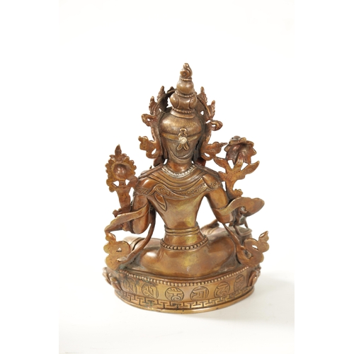 79 - A BRONZE AND JEWELLED TIBETAN BRONZE SCULPTURE modelled as a Tara Buddha with turquoise and coral ca... 