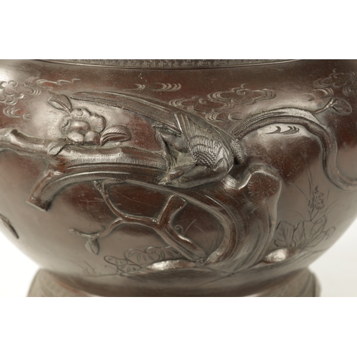 82 - A LARGE JAPANESE MEIJI PERIOD BRONZE JARDINERE the bulbous body decorated with birds in flight and b... 