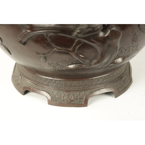 82 - A LARGE JAPANESE MEIJI PERIOD BRONZE JARDINERE the bulbous body decorated with birds in flight and b... 