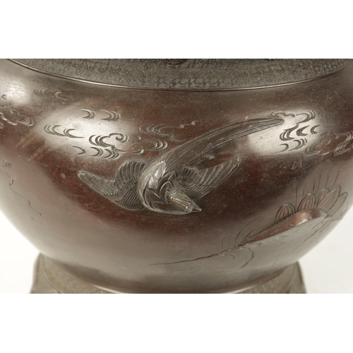 82 - A LARGE JAPANESE MEIJI PERIOD BRONZE JARDINERE the bulbous body decorated with birds in flight and b... 