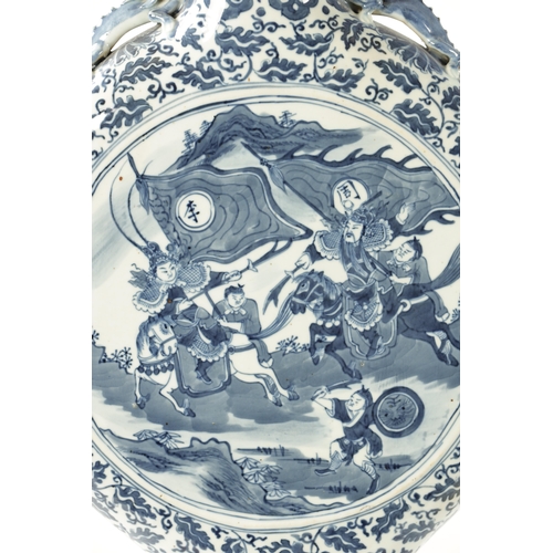 86 - A 19TH CENTURY OVER-SIZED CHINESE BLUE AND WHITE MOON FLASK with dragon handles and foliated border ... 