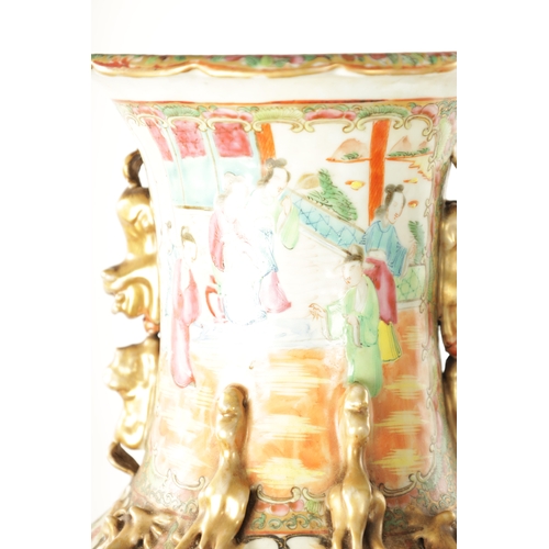 91 - A LARGE PAIR OF 19TH CENTURY CANTON FAMILLE ROSE VASES ON STANDS having panelled figural scenes and ... 