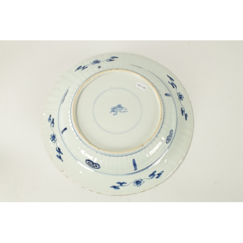 94 - A CHINESE KANGXI PERIOD BLUE AND WHITE PORCELAIN CHARGER with all over floral decoration. (34.5cm di... 