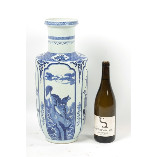 95 - A 19TH CENTURY BLUE AND WHITE CHINESE VASE the slightly tapered body with panelled decoration of flo... 