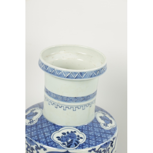 95 - A 19TH CENTURY BLUE AND WHITE CHINESE VASE the slightly tapered body with panelled decoration of flo... 