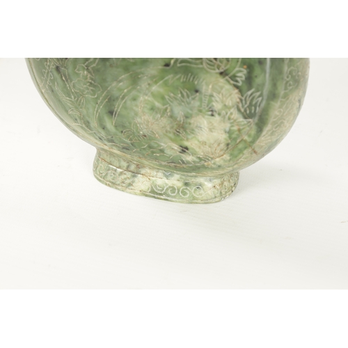 98 - A LARGE CHINESE SPINACH-GREEN JADE TWO-HANDLED VASE with a bulbous body engraved with peacocks among... 