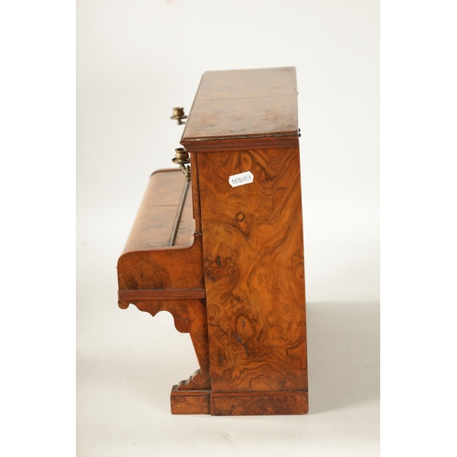 336 - A 19TH CENTURY FIGURED WALNUT CIGAR COMPENDIUM FORMED AS AN UPRIGHT PIANO decorated with marquetry p... 