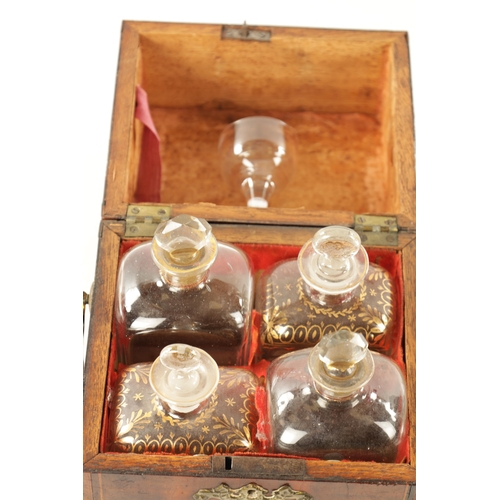 338 - AN EARLY 18TH CENTURY INLAID YEW WOOD VENEERED DECANTER BOX with hinged top revealing four gilt glas... 