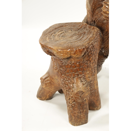 345 - A GOOD 19TH CENTURY CARVED LINDEN WOOD BLACK FOREST BEAR STOOL with standing bear in front of a stum... 