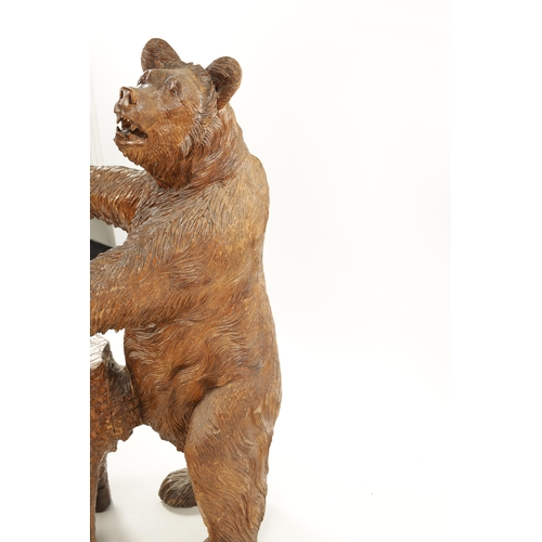 345 - A GOOD 19TH CENTURY CARVED LINDEN WOOD BLACK FOREST BEAR STOOL with standing bear in front of a stum... 