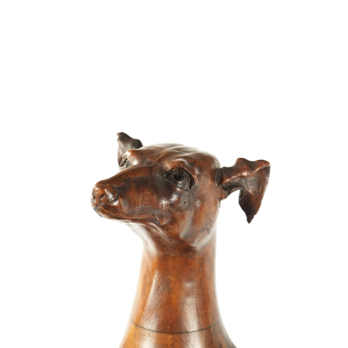 351 - A GOOD 19TH CENTURY CARVED WALNUT OVER-SIZED SCULPTURE OF A SEATED GREYHOUND on a tiered rectangular... 