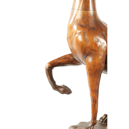 351 - A GOOD 19TH CENTURY CARVED WALNUT OVER-SIZED SCULPTURE OF A SEATED GREYHOUND on a tiered rectangular... 