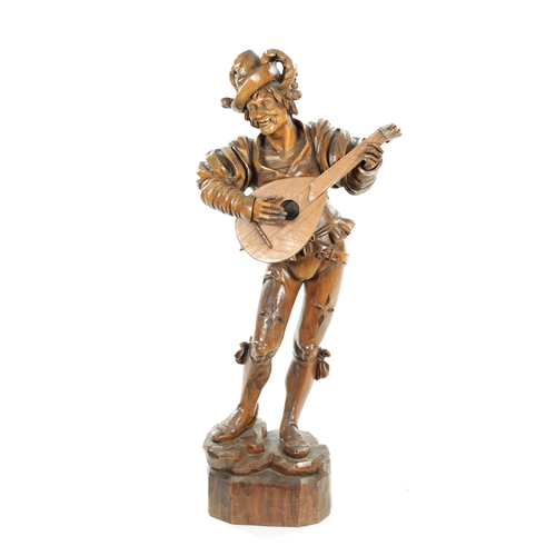 354 - A GOOD 19TH CENTURY BLACK FOREST CARVED LINDEN WOOD FIGURE OF A MUSICIAN depicting a lute player on ... 