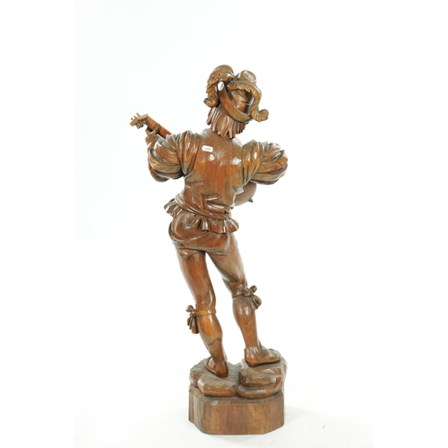 354 - A GOOD 19TH CENTURY BLACK FOREST CARVED LINDEN WOOD FIGURE OF A MUSICIAN depicting a lute player on ... 