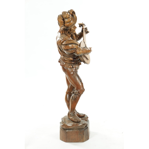 354 - A GOOD 19TH CENTURY BLACK FOREST CARVED LINDEN WOOD FIGURE OF A MUSICIAN depicting a lute player on ... 