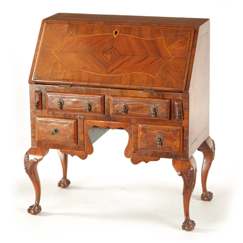 356 - A GEORGE II STYLE MINIATURE WALNUT BUREAU with boxwood strung inlays having an angled fall with smal... 