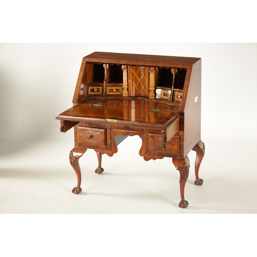 356 - A GEORGE II STYLE MINIATURE WALNUT BUREAU with boxwood strung inlays having an angled fall with smal... 