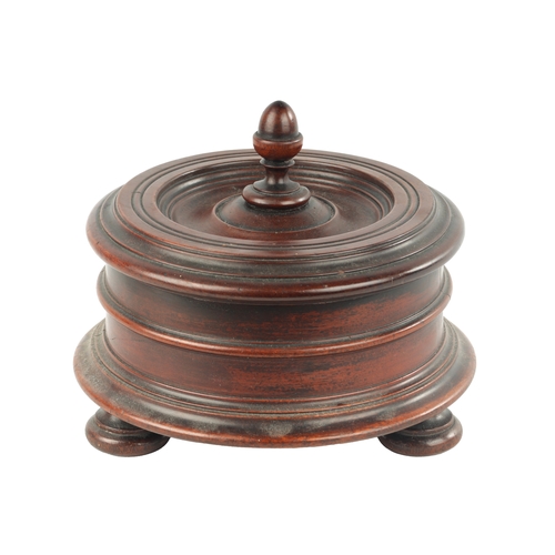 358 - AN 18TH CENTURY MAHOGANY TREEN WARE LIDDED BOX with turned lid fitted acorn shaped handle; raised on... 