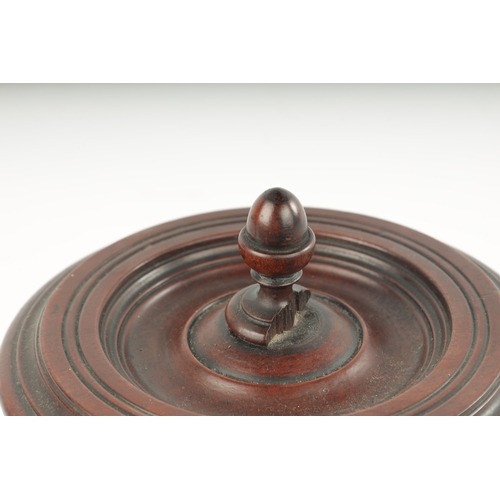 358 - AN 18TH CENTURY MAHOGANY TREEN WARE LIDDED BOX with turned lid fitted acorn shaped handle; raised on... 