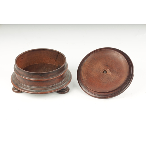 358 - AN 18TH CENTURY MAHOGANY TREEN WARE LIDDED BOX with turned lid fitted acorn shaped handle; raised on... 