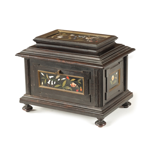 385 - A 19TH CENTURY FRENCH EBONY AND PIETRA DURA PANELLED JEWELLERY CASKET the moulded box inset with Ita... 