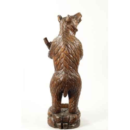 387 - A GOOD 19TH CENTURY CARVED WALNUT BLACK FOREST STANDING BEAR STICK STAND depicting a standing bear r... 