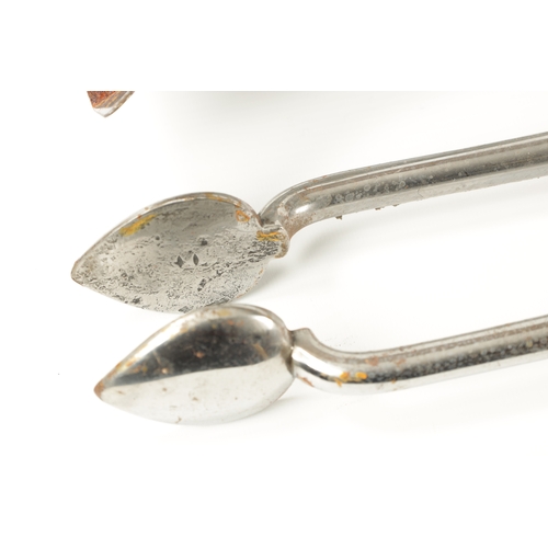 388 - A SET OF TWO COUNTRY HOUSE GEORGIAN STEEL FIRE IRONS comprising of a shaped shovel and tongs, having... 