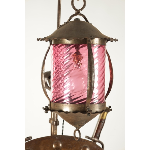 391 - A STYLISH ART AND CRAFTS PLANISHED COPPER AND STEEL ADJUSTABLE STANDARD LAMP with hanging ruby glass... 