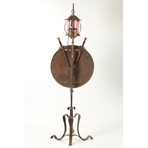 391 - A STYLISH ART AND CRAFTS PLANISHED COPPER AND STEEL ADJUSTABLE STANDARD LAMP with hanging ruby glass... 