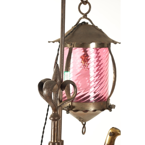 391 - A STYLISH ART AND CRAFTS PLANISHED COPPER AND STEEL ADJUSTABLE STANDARD LAMP with hanging ruby glass... 