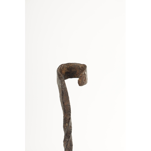 392 - A 17TH CENTURY WROUGHT IRON TALLOW STICK POSSIBLY IRISH with twisted stem and circular openwork trip... 