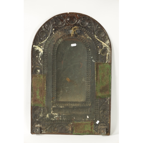 394 - AN 18TH CENTURY PRESSED BRASS WALL SCONCE with arched scrolled leafwork border and cushion centre; h... 