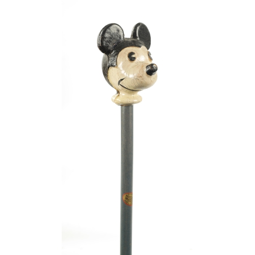 396 - A VINTAGE MICKEY MOUSE WALKING CANE with painted head and labelled shaft. (86.5cm overall)