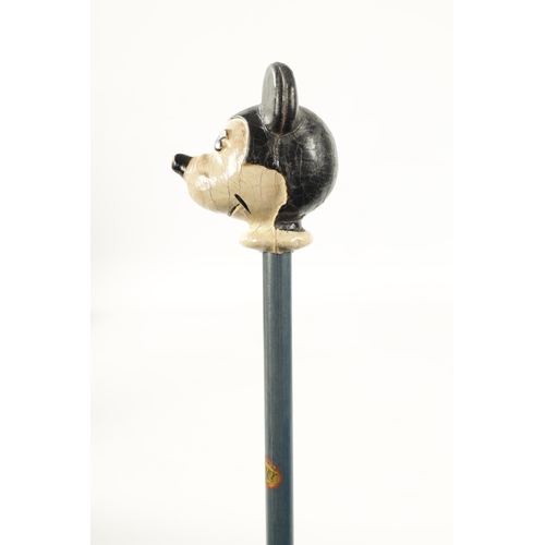 396 - A VINTAGE MICKEY MOUSE WALKING CANE with painted head and labelled shaft. (86.5cm overall)