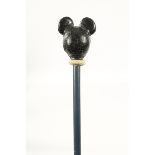 396 - A VINTAGE MICKEY MOUSE WALKING CANE with painted head and labelled shaft. (86.5cm overall)