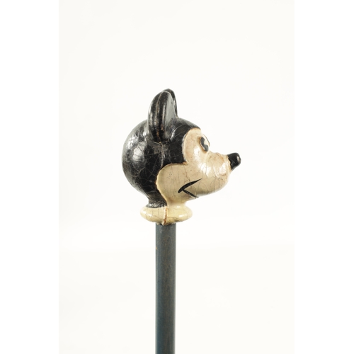 396 - A VINTAGE MICKEY MOUSE WALKING CANE with painted head and labelled shaft. (86.5cm overall)