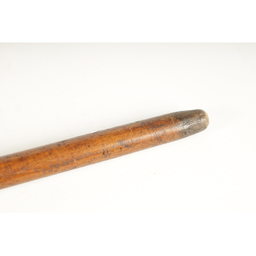 397 - A LATE 19TH CENTURY CARVED HARDWOOD WALKING STICK FORMED AS A MĀORI having facial decoration on a ta... 