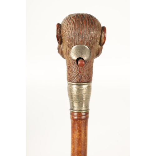 398 - A LATE 19TH NOVELTY WALKING STICK FORMED AS A MONKEY HEAD WITH AUTOMATON EYES AND MOUTH having a sil... 