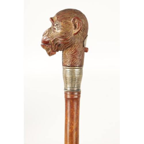 398 - A LATE 19TH NOVELTY WALKING STICK FORMED AS A MONKEY HEAD WITH AUTOMATON EYES AND MOUTH having a sil... 