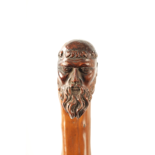 401 - A LATE 18TH/EARLY 19TH CENTURY CARVED ROOTWOOD WALKING STICK the carved monk's head handle above haw... 