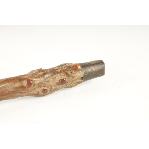 401 - A LATE 18TH/EARLY 19TH CENTURY CARVED ROOTWOOD WALKING STICK the carved monk's head handle above haw... 