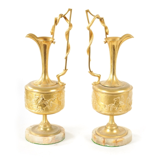 408 - A PAIR OF LATE 19TH CENTURY FRENCH GILT BRONZE CLASSICAL EWERS ON ALABASTER BASES with slender flare... 