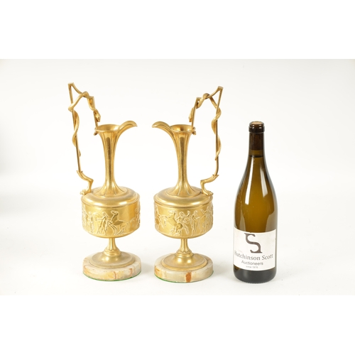 408 - A PAIR OF LATE 19TH CENTURY FRENCH GILT BRONZE CLASSICAL EWERS ON ALABASTER BASES with slender flare... 